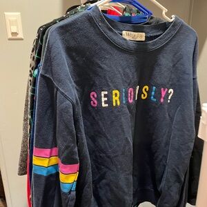 Wound Up Blue and Pink Sweatshirt Playful Design